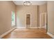 Spacious bedroom with hardwood floors and access to bathroom at 1608 Golden Creek Sw Ct, Conyers, GA 30094