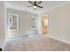 Spacious bedroom with carpet flooring and ceiling fan at 929 Hilltop Park Ct, Dacula, GA 30019