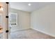 Simple bedroom with neutral carpeting and one window at 929 Hilltop Park Ct, Dacula, GA 30019