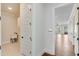 Bright hallway with laundry room and access to other rooms at 929 Hilltop Park Ct, Dacula, GA 30019
