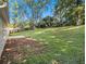 Large backyard with grassy area and patio at 302 Granite Grv, Loganville, GA 30052
