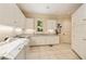 Bright laundry room with ample cabinetry and counter space at 4660 Jett Rd, Atlanta, GA 30327