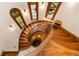 Elegant spiral staircase with rich wood detailing at 4660 Jett Rd, Atlanta, GA 30327