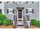 Townhome entrance with black door, awning, and black railings at 1804 Barrington Overlook, Marietta, GA 30066