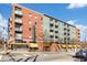 Modern building exterior with brick and green accents, showcasing its contemporary design at 620 Glen Iris Ne Dr # 205, Atlanta, GA 30308