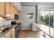Eat-in kitchen featuring granite countertops and wood cabinets at 620 Glen Iris Ne Dr # 205, Atlanta, GA 30308