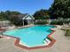 Inviting in-ground pool with brick coping and pool house at 410 Kilcrease Rd, Auburn, GA 30011