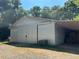 Spacious metal barn with covered storage area for hay at 410 Kilcrease Rd, Auburn, GA 30011