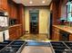 Modern kitchen with stainless steel appliances, granite countertops, and dark wood cabinets at 410 Kilcrease Rd, Auburn, GA 30011