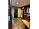Modern kitchen with stainless steel appliances, granite countertops, and dark wood cabinets at 410 Kilcrease Rd, Auburn, GA 30011
