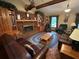 Spacious living room with a cozy fireplace and built-in shelving at 410 Kilcrease Rd, Auburn, GA 30011