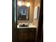 Small bathroom with vanity, sink, and medicine cabinet at 410 Kilcrease Rd, Auburn, GA 30011