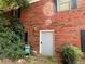 Gray exterior door and brick wall at 410 Kilcrease Rd, Auburn, GA 30011
