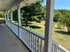 Covered porch overlooking the expansive backyard at 410 Kilcrease Rd, Auburn, GA 30011