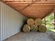 Covered area with neatly stacked hay bales at 410 Kilcrease Rd, Auburn, GA 30011