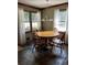 Charming dining area with hardwood floors and a round wooden table at 410 Kilcrease Rd, Auburn, GA 30011