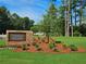 Azalea Square community entrance, brick sign, landscaping, pond view at 1206 Brooks Ryan Run(Lot 102), Lawrenceville, GA 30043