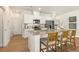 Modern kitchen with stainless steel appliances and granite island at 1206 Brooks Ryan Run(Lot 102), Lawrenceville, GA 30043