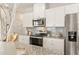 Modern kitchen with granite countertops and stainless steel appliances at 1206 Brooks Ryan Run(Lot 102), Lawrenceville, GA 30043