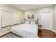 King-size bed, hardwood floors, and neutral walls in main bedroom at 604 Glen Iris Ne Dr, Atlanta, GA 30308