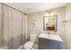 Small bathroom with shower/tub combo and gray vanity at 604 Glen Iris Ne Dr, Atlanta, GA 30308