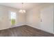 Bright dining room features wood-look floors and sliding glass door leading to patio at 105 Adrian Dr, Stockbridge, GA 30281