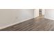 Simple bedroom with wood-look floors and access to hallway at 105 Adrian Dr, Stockbridge, GA 30281