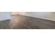 Spacious basement with grey wood-look vinyl flooring at 105 Adrian Dr, Stockbridge, GA 30281