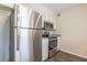 Stainless steel appliances and granite countertops in this well-lit kitchen at 105 Adrian Dr, Stockbridge, GA 30281