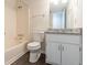 Clean bathroom with granite vanity, tub shower combo, and wood-look floors at 105 Adrian Dr, Stockbridge, GA 30281
