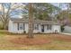 Ranch style home with neutral exterior and landscaping at 105 Adrian Dr, Stockbridge, GA 30281