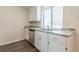 Kitchen boasts granite countertops, stainless steel appliances, and white cabinets at 105 Adrian Dr, Stockbridge, GA 30281