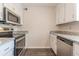 Modern kitchen with stainless steel appliances and granite countertops at 105 Adrian Dr, Stockbridge, GA 30281