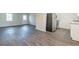 Open living area with wood-look floors and access to kitchen at 105 Adrian Dr, Stockbridge, GA 30281