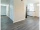 Living room with grey vinyl flooring and open concept layout at 105 Adrian Dr, Stockbridge, GA 30281