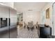 Open concept dining area with glass table and patterned floor at 679 Forest Ridge Se Dr, Marietta, GA 30067