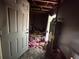 Unfinished basement with water heater and debris at 445 Independence Dr, Jonesboro, GA 30238