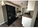 Renovated kitchen with black appliances and granite counters at 445 Independence Dr, Jonesboro, GA 30238
