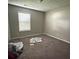 Simple bedroom with neutral walls and carpeted floor at 445 Independence Dr, Jonesboro, GA 30238