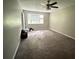 Spacious bedroom with ceiling fan and large window at 445 Independence Dr, Jonesboro, GA 30238