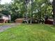 House exterior with wooded backyard and driveway at 445 Independence Dr, Jonesboro, GA 30238
