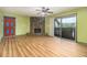 Living room featuring light wood floors, a stone fireplace, and sliding glass doors at 112 Camelot Dr, Atlanta, GA 30349