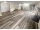 Spacious living room featuring wood-look floors and fireplace at 6383 Wedgewood Trce, Tucker, GA 30084