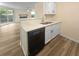 Modern kitchen with quartz countertops and stainless steel dishwasher at 6383 Wedgewood Trce, Tucker, GA 30084