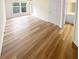 Bright living room with wood-look floors and sliding glass doors at 6383 Wedgewood Trce, Tucker, GA 30084