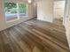 Bright bedroom with large windows and wood-look flooring at 6383 Wedgewood Trce, Tucker, GA 30084
