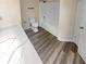 Bathroom with a tub, shower, and quartz countertop at 6383 Wedgewood Trce, Tucker, GA 30084