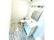 Updated bathroom with white vanity, new flooring and a large mirror at 4701 Flat Shoals Rd # 68D, Union City, GA 30291
