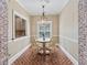 Cozy breakfast nook with brick accents and a view into the kitchen at 3920 Drew Campground Rd, Cumming, GA 30040