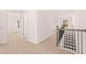 Upper level hallway showcasing neutral tones and carpet at 1718 Lacebark Elm Way, Lawrenceville, GA 30045